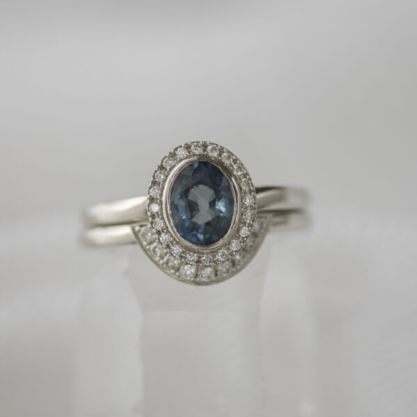 Sapphire halo ring with contoured matching band